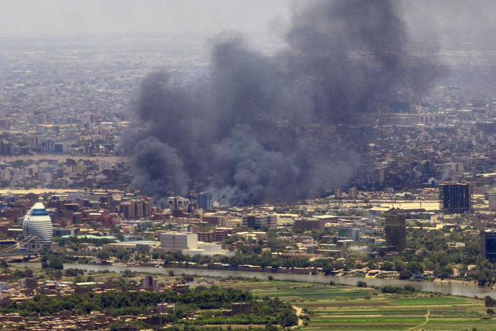Smoke billows during fighting in the Sudanese capital Khartoum on Wednesday. Hundreds have been killed and thousands injured in the fighting.