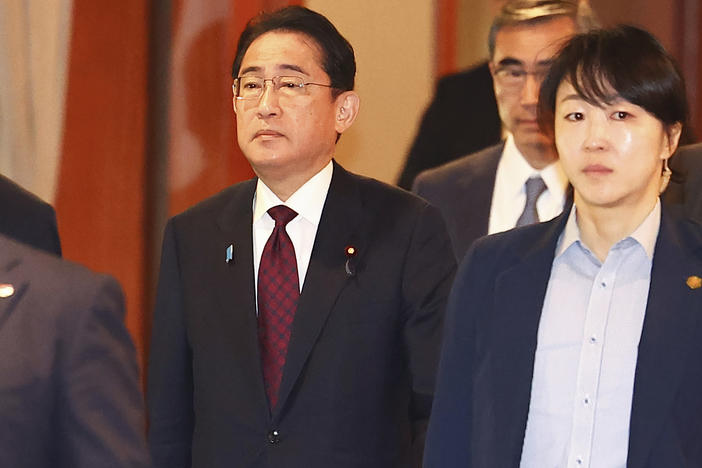 Japanese Prime Minister Fumio Kishida, center, leaves after meeting with business leaders at a hotel in Seoul, South Korea, Monday, May 8, 2023.