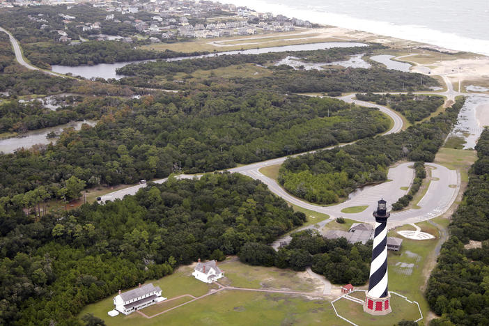 In this Sept. 15, 2018, file photo, the Cape Hatteras Lighthouse sits way off the beach in Buxton, N.C.