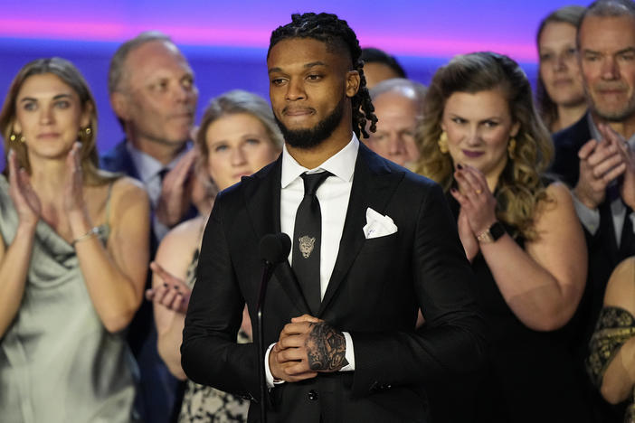 Buffalo Bills' Damar Hamlin speaks in front of University of Cincinnati Medical Center staff during the NFL Honors award show ahead of the Super Bowl 57 football game, Thursday, Feb. 9, 2023, in Phoenix.