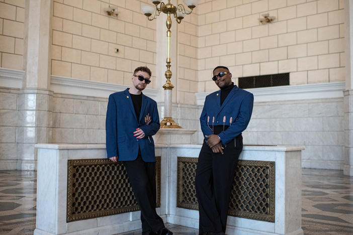 Andrii Hutsuliak (L) and Jeffrey Kenny (R) pose for a portrait in Ukraine's Central Kyiv Railway Station on April 28.