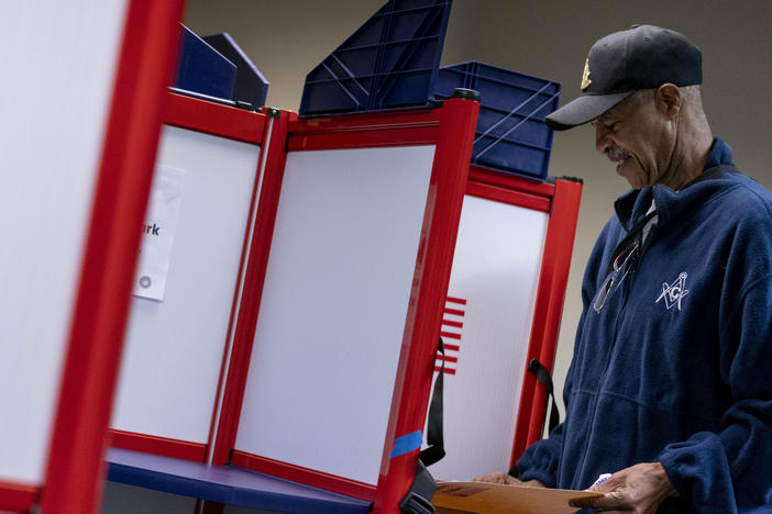 A voter fills out his ballot at an early voting location in Alexandria, Va., on Sept. 26, 2022.