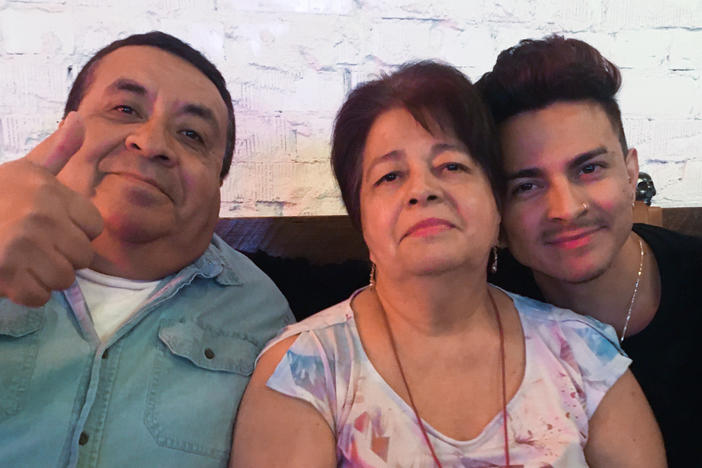 Miguel Lerma, right, with his grandparents who raised him, Jose and Virginia Aldaco.