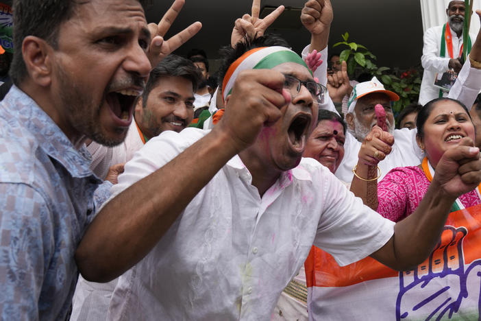 Supporters of the opposition Congress party celebrate early leads in the Karnataka state elections in Bengaluru, India, on Saturday.