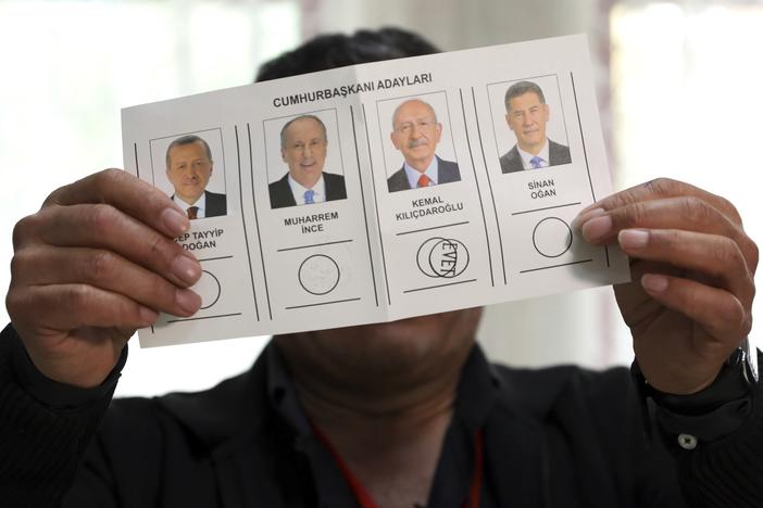 An election representative shows a ballot depicting a vote for Kemal Kilicdaroglu at a polling station in Ankara, Turkey, on Sunday.