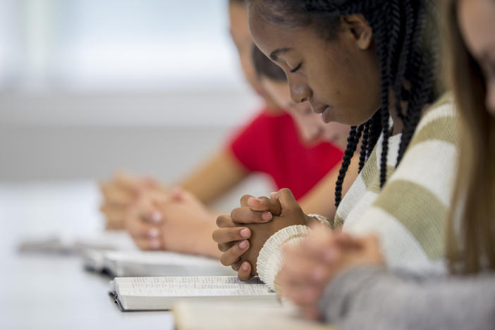 New guidance from the Department of Education says a school may take reasonable measures to ensure students aren't pressured to join in their teachers' or coaches' prayers.