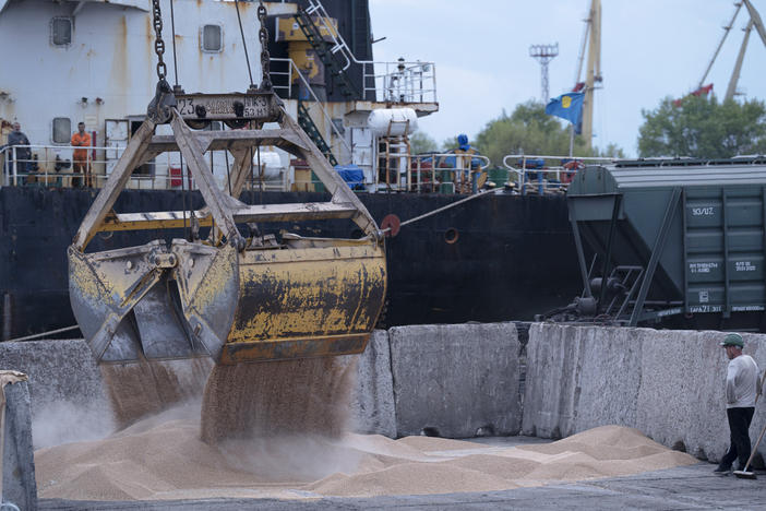 Workers load grain at a port in Izmail, Ukraine, on April 26. A United Nations-backed deal has been extended allowing shipments of Ukrainian grain through the Black Sea to parts of the world struggling with hunger.