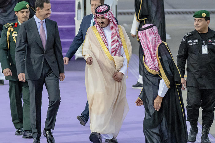 In this photo provided by Saudi Press Agency, Syrian President Bashar Assad (left) is accompanied by Prince Badr bin Sultan, the deputy governor of Mecca, upon his arrival at Jeddah airport, Saudi Arabia, Thursday, ahead of the Arab summit.