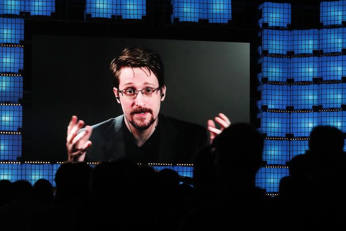 From Moscow, former U.S. National Security Agency contractor Edward Snowden addresses a technology conference in Portugal in 2019. Snowden fled the U.S. in 2013 and revealed highly classified U.S. surveillance programs. He's been living in Russia for the past decade, and received Russian citizenship last year.