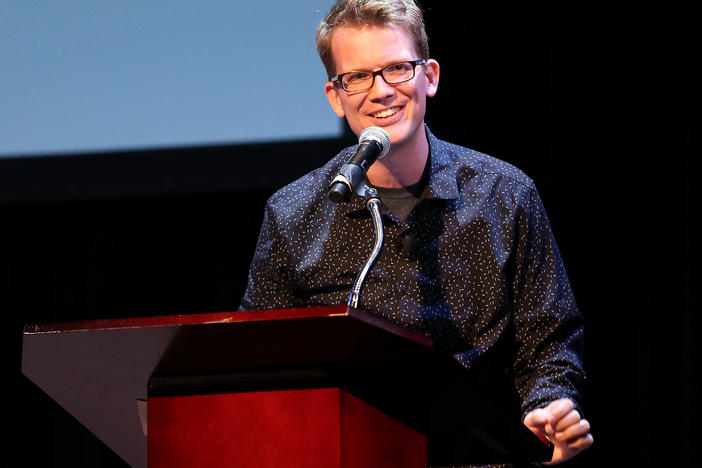 YouTube personality and author Hank Green speaks on stage as he discusses his new book, <em>An Absolutely Remarkable Thing</em> in New York City on Sept. 25, 2018.