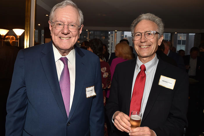 A federal investigation found former U.S. Agency for Global Media CEO Michael Pack (at right) repeatedly engaged in abuses of power and gross mismanagement. Pack, shown last year at a party with conservative politician and publisher Steve Forbes, sought to stamp out all hints of anti-Trump sentiment at the agency, the Voice of America, and other networks funded by the federal government.