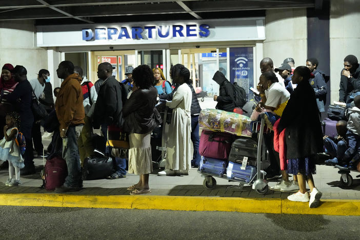 Evacuees from Sudan arrive at the Robert Mugabe International airport in Harare, Zimbabwe, on April, 28.