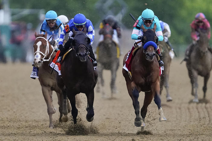 National Treasure, with jockey John Velazquez, front right, edges out Blazing Sevens, with jockey Irad Ortiz Jr., second from left, to win the148th running of the Preakness Stakes horse race at Pimlico Race Course, on Saturday in Baltimore.