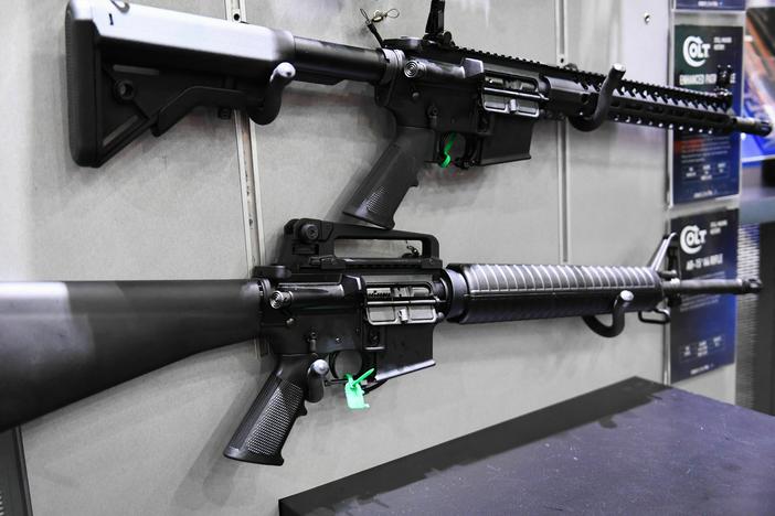 Colt M4 Carbine and AR-15 style rifles are displayed during the National Rifle Association (NRA) Annual Meeting in Houston, Texas on May 28, 2022. A Maryland man is causing concern for carrying an AR-15 style rifle near a school bus stop.