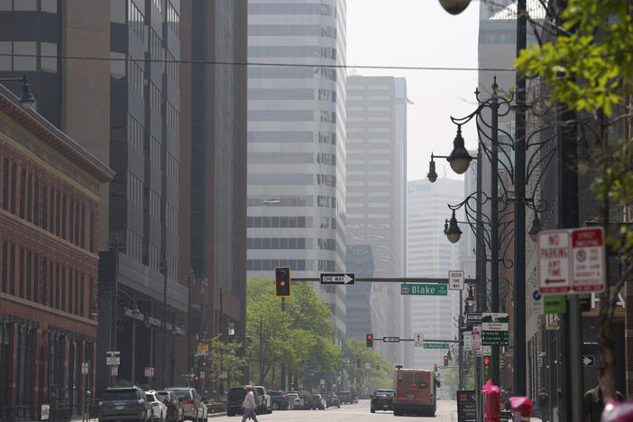 A smoky haze shrouds the high-rise buildings in downtown Denver on Saturday, May 20.