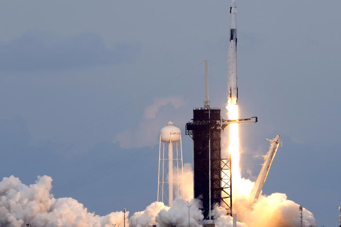 A SpaceX Falcon 9 rocket, with the Dragon capsule and a crew of four private astronauts lifts off from pad 39A, at the Kennedy Space Center in Cape Canaveral, Fla., on Sunday.