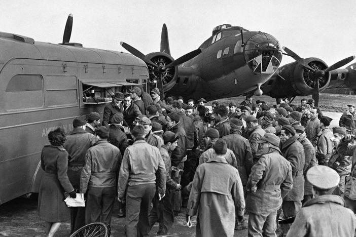 During World War II, the American Red Cross Clubmobile corps (shown here on an airfield in England in 1943) provided donuts, coffee and friendly conversation to the troops.