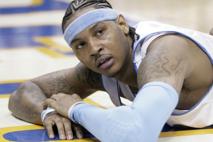 Denver Nuggets forward Carmelo Anthony looks up from the floor after getting called for a foul in the fourth quarter of game 3 of the NBA Western Conference playoff series against the San Antonio Spurs in Denver on April 28, 2007. Anthony, who led Syracuse to an NCAA championship in his lone college season and went on to spend 19 years in the NBA, announced his retirement on Monday, May 22, 2023.