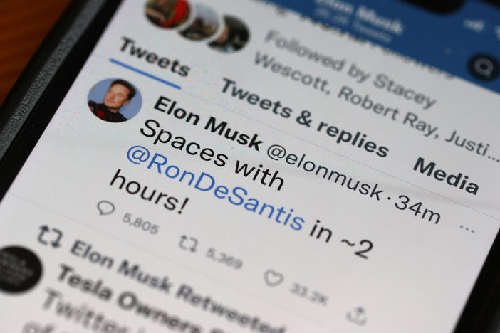 In this photo illustration, businessman and Twitter owner Elon Musk tweets about a Twitter Spaces event he will be hosting with Florida Gov. Ron DeSantis on May 24.