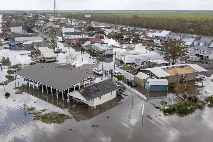 Water surrounds damaged homes in Lafourche Parish, La., after Hurricane Ida in 2021. Many people in Louisiana are still recovering from past hurricanes as this year's hurricane season gets underway. "Anytime we have a community that is still going through a recovery from a previous storm, it just makes them that much more vulnerable," says FEMA Administrator Deanne Criswell.