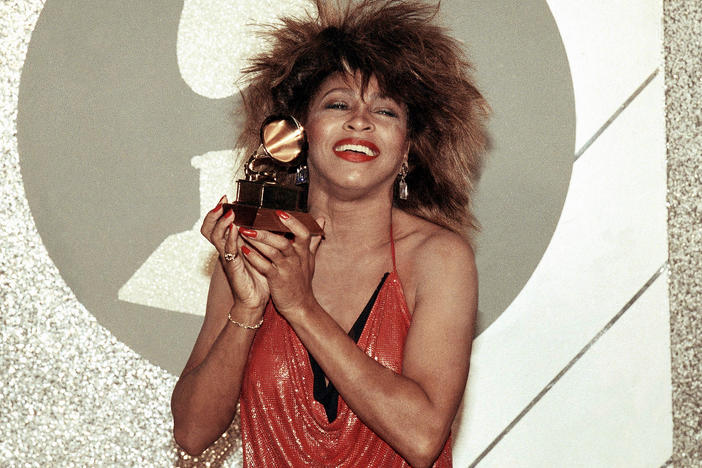 Tina Turner, Pop and R&B vocalist, holds up a Grammy Award, Feb. 27, 1985, in Los Angeles. Turner, the unstoppable singer and stage performer, died Wednesday, after a long illness at her home in Küsnacht near Zurich, Switzerland, according to her manager. She was 83.