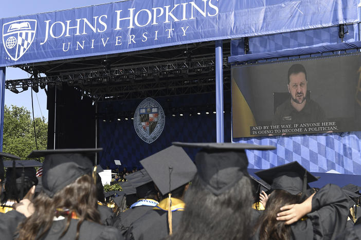 Ukrainian President Volodymyr Zelenskyy addresses the graduating class of Johns Hopkins University via livestream from Ukraine on Thursday in Baltimore.