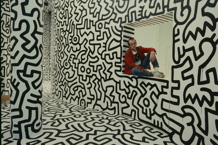 Keith Haring at his Pop Shop in SoHo, 1986