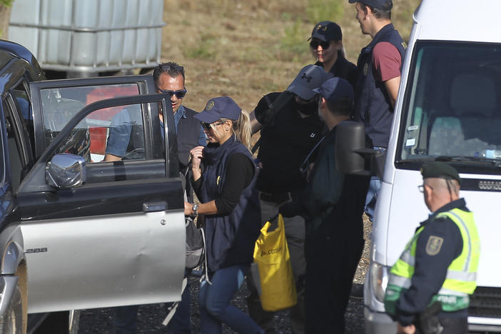 Police search teams prepare to set out from an operation tent near Barragem do Arade, Portugal, Wednesday May 24, 2023.