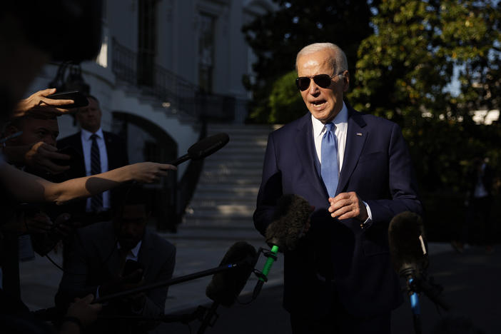 President Biden talks to reporters as he departs the White House for the Memorial Day holiday weekend.