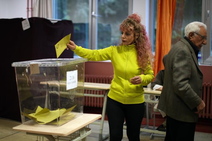 A woman votes at a polling station in Istanbul, Turkey, Sunday, May 28, 2023. Voters in Turkey return to the polls Sunday to decide whether the country's longtime leader stretches his increasingly authoritarian rule into a third decade or is unseated by a challenger who has promised to restore a more democratic society.