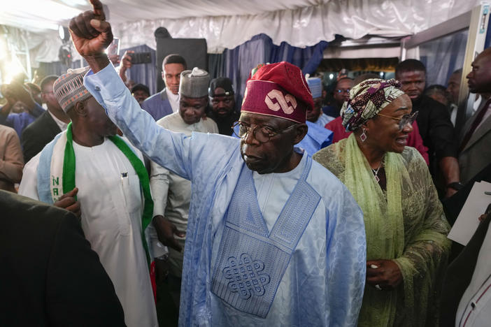 Bola Tinubu, center, of the All Progressives Congress, celebrates with supporters at the party's campaign headquarters after winning the presidential elections in Abuja, Nigeria, in March.
