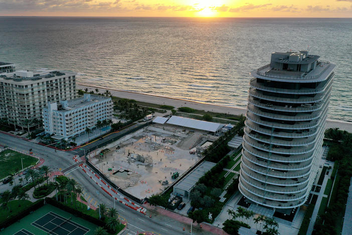 In an aerial view, a cleared lot where the 12-story Champlain Towers South condo building once stood is seen on June 22, 2022, in Surfside, Fla. It had been a year since the tragic event where 98 people died when the building partially collapsed on June 24, 2021.