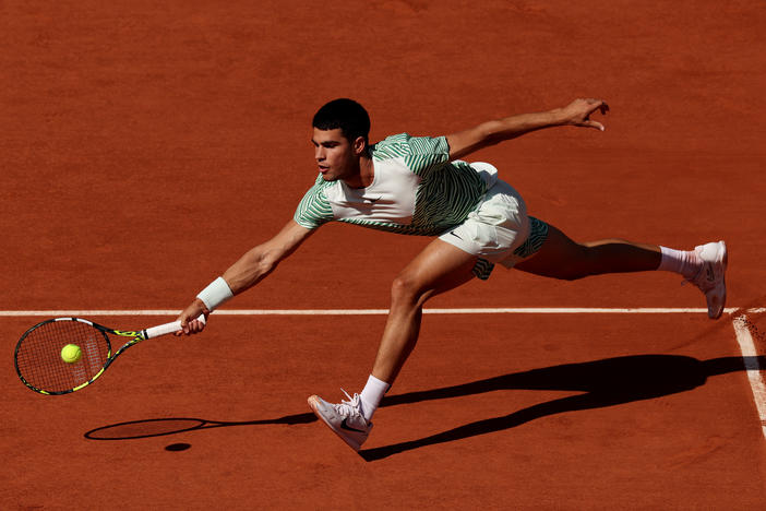 Carlos Alcaraz of Spain plays a forehand against Taro Daniel of Japan during a Second Round Match at the 2023 French Open at Roland Garros on May 31, 2023 in Paris, France.