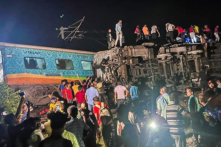Rescuers work at the site of passenger trains that derailed in Balasore district, in the eastern Indian state of Orissa, on Friday.