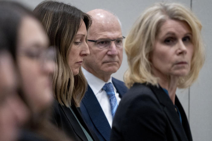 Dr. Caitlin Bernard (center left) sits next to her attorneys during a May 25 hearing before the Indiana Medical Licensing Board in downtown Indianapolis.
