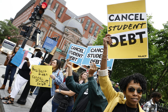 Student loan borrowers gather near The White House in May 2020. On Thursday, the Senate voted to repeal President Biden's plan to offer up to $20,000 in federal student loan debt relief.