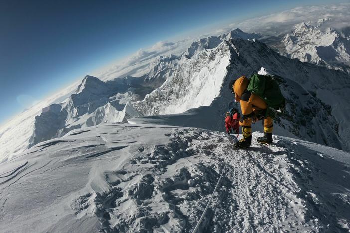Mountaineers make their way to the summit of Mount Everest, as they ascend on the south face from Nepal on May 17, 2018.