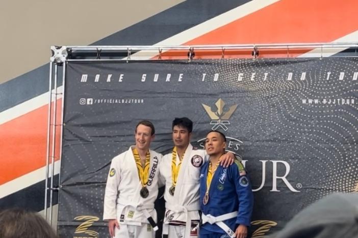 Mark Zuckerberg, left, alongside Jeff Ibrahim, center, following their jiu-jitsu match on May 6 in California. One of the third place competitors, Henry Francisco, is at right.