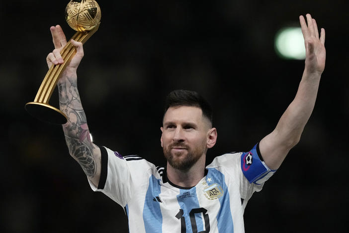 Argentina's Lionel Messi waves after receiving the Golden Ball award for best player at the end of the World Cup final soccer match between Argentina and France at the Lusail Stadium in Qatar on  Dec. 18, 2022.