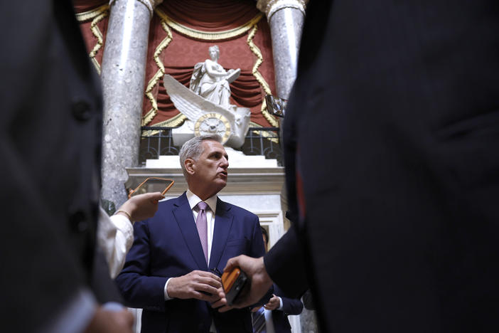 House Speaker Kevin McCarthy speaks to reporters as he walks to the House floor on Tuesday.