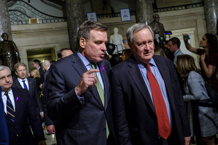 Sens. Mark Warner and Mike Crapo, seen here making their way to the House chamber for President Trump's first State of the Union Address in 2018, are announcing an effort to expand access to capital for small businesses emerging from the pandemic.