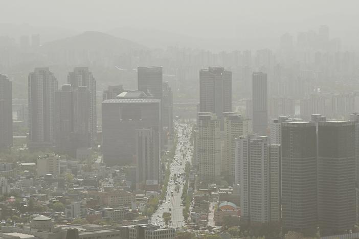 A general view showing buildings shrouded by polluted air in Seoul on April 12, 2023.