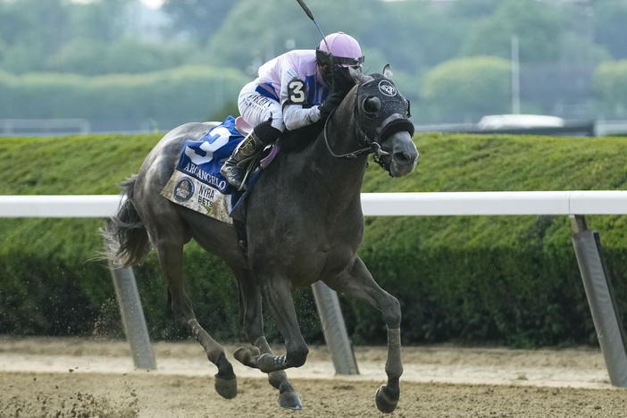 Arcangelo, with jockey Javier Castellano, breaks away from the pack in the final stretch to win the 155th running of the Belmont Stakes horse race on Saturday, at Belmont Park in Elmont, N.Y.