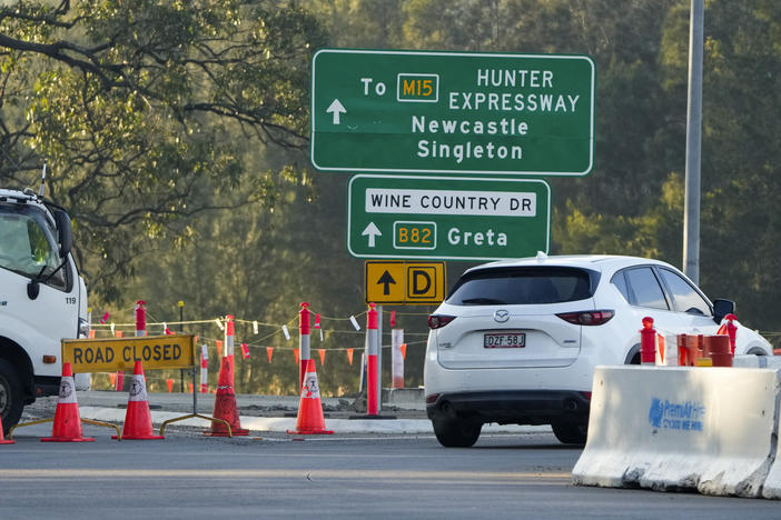 A roadblock is set up near the town of Greta following a bus crash in the Hunter Valley, north of Sydney, Australia on Monday.