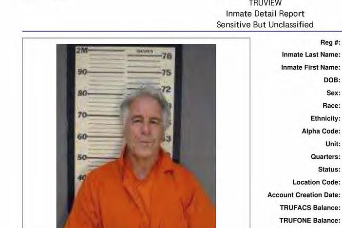 Lawsuits over big banks' role in Jeffrey Epstein's sex-trafficking ring have now secured hundreds of millions of dollars in settlements. Here, a photo shows a Federal Bureau of Prisons page for Epstein, part of a trove of documents obtained by the Associated Press this month.