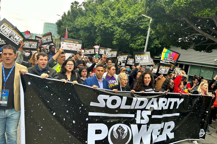 A myriad of workers rallied in downtown Los Angeles in support of striking writers, during an event called "The Unions Strike Back" on May 26, 2023.