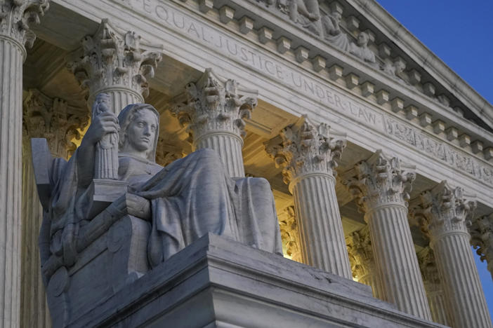 Light illuminates part of the Supreme Court building in Washington on Nov. 16, 2022.