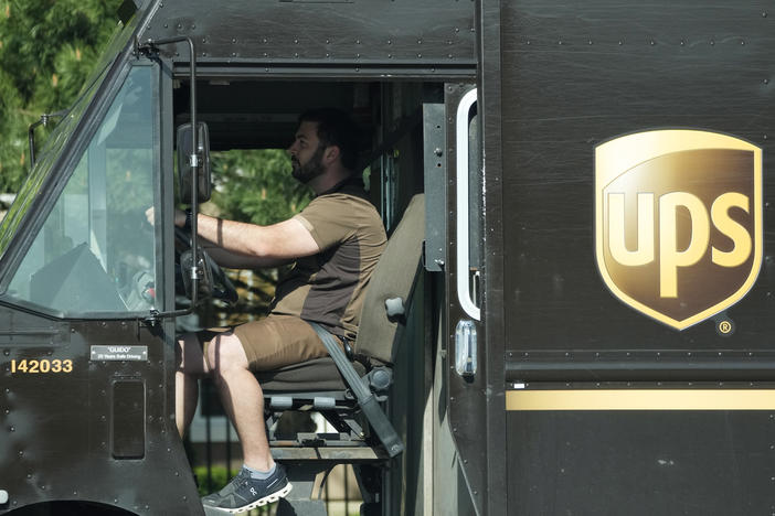 A UPS driver makes deliveries in Northbrook, Ill., on May 10.