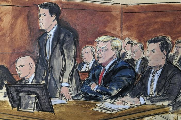 In this courtroom sketch, attorney Todd Blanche stands as he enters a plea of not guilty on behalf of former President Donald Trump in federal court on Tuesday in Miami. From left are: Stanley Woodward, Walt Nauta, Blanche, Trump and Chris Kise.