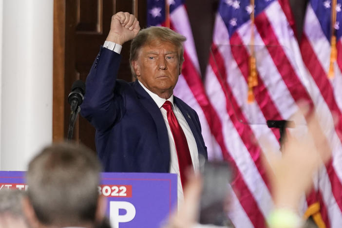 Former President Donald Trump gestures after speaking at Trump National Golf Club in Bedminster, N.J., Tuesday after pleading not guilty in a Miami courtroom earlier in the day to dozens of felony counts that he hoarded classified documents and refused government demands to give them back.